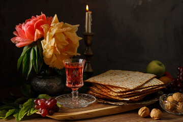 Passover celebration with wine and matzah. Pesach background. Copy space