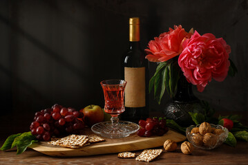 Passover celebration with wine and matzah. Pesach background. Copy space