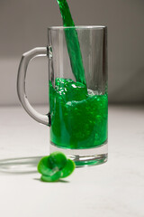 Green beer ale, a drink for celebrating St. Patrick's Day, taken at close range