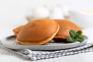 Japanese dorayaki pancakes with a sprig of mint.