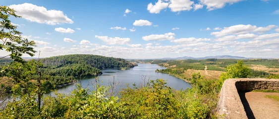 The Rotestein viewpoint (Harz Mountains, Germany) offers a nice view over the Rappbode reservoir. It's located near the town of Hasselfelde. In good weather conditions you can see the Brocken.