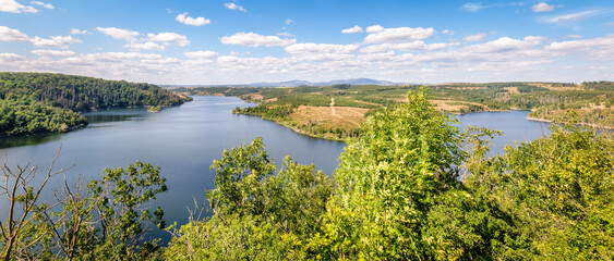 The Rotestein viewpoint (Harz Mountains, Germany) offers a nice view over the Rappbode reservoir. It's located near the town of Hasselfelde. In good weather conditions you can see the Brocken.