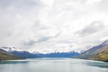 Serene Lake Surrounded by Snow-Capped Mountains – Breathtaking Landscape