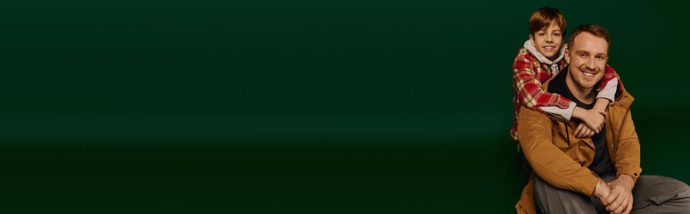 Joyful bonding moments between father and son in stylish casual outfits