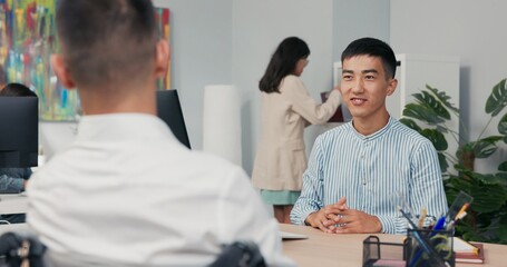 Two men meet in company office morning for interview disabled boy arrives in wheelchair wearing...