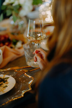 Elegant dining setting with a glass of white wine and gourmet dish