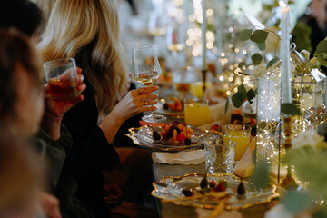 Elegant Table Setting with Drinks and Desserts for a Festive Celebration
