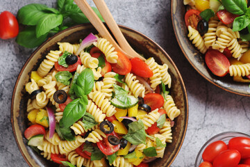 A bowl with traditional Italian pasta salad	