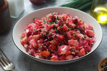 A bowl with Vinegret salad, a typical Russian dish