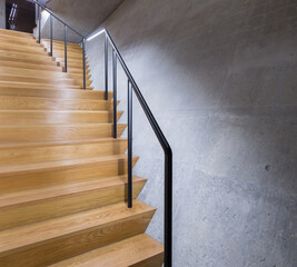 Spiral Concrete Staircase with Wooden Handrail