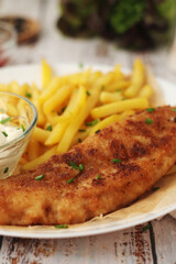 Fish and chips served on the plate, traditional dish of Great Britain