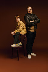 Joyful moments shared between father and son in a stylish studio setting