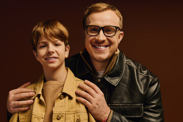 Joyful moments shared between father and son in casual studio outfits © LIGHTFIELD STUDIOS