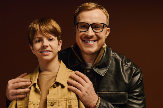 Joyful moments shared between father and son in casual studio outfits