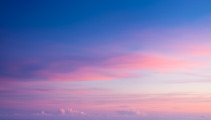 Obraz premium vivid pastel sky with soft cloudscape and gentle sunrise gradient over lavender horizon