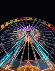 Colorful illuminated ferris wheel set vibrant carnival atmosphere 