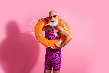 Photo of aged funky man rescuer hold wear orange buoy swimsuit isolated pastel color background