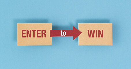 A sign that says enter to win is on a blue background