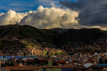Cusco cityscape with dramatic clouds.