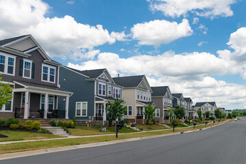 Row of new development two story houses with front garage driveway, New Neighborhoods in Leesburg, Virginia.