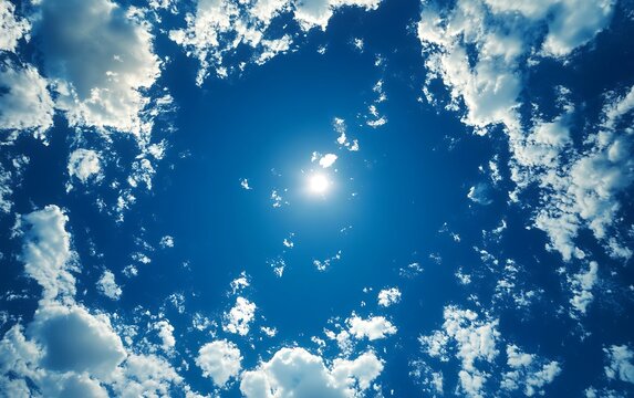 Sunny sky with puffy clouds, looking up.  Possible stock use image of beautiful daytime sky