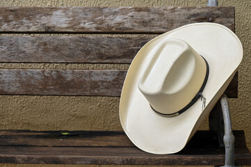 cowboy style hat straw hat with black ribbon isolated on white background, straw hat for women and...