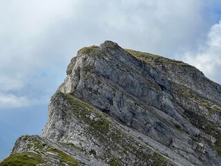 Alpine peaks Chli Hohmad (2492 m) and Gross Hohmad (2307 m) above the Tannensee lake (or Tannen lake) and in the Uri Alps mountain massif, Melchtal - Canton of Obwalden, Switzerland (Schweiz)