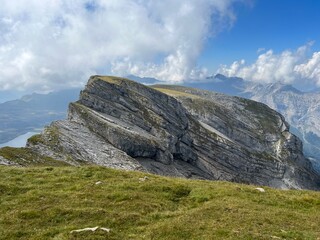 Alpine peaks Chli Hohmad (2492 m) and Gross Hohmad (2307 m) above the Tannensee lake (or Tannen lake) and in the Uri Alps mountain massif, Melchtal - Canton of Obwalden, Switzerland (Schweiz)