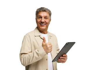 Smiling man giving thumbs up while holding tablet in modern studio setting