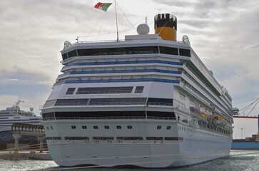 Modern mega cruiseship cruise ship liner Fortuna docked in Malaga, Spain with beach and coast line...