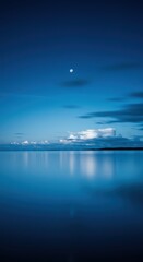 Tranquil night sky over a serene ocean with reflections of moon and clouds