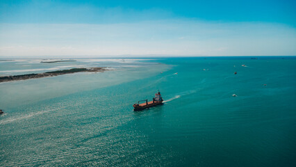 Aerial View of Cargo Ship in Turquoise Coastal Waters of Cebu