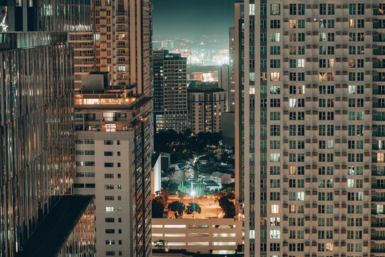 View Between Skyscrapers At Night In Cebu City, Philippines