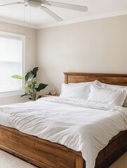Beautiful bedroom showing wooden bed with nice white bedspread