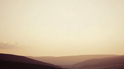Obraz premium A breathtaking golden sky at sunrise, with warm hues of orange and gold illuminating a peaceful, calm landscape below.