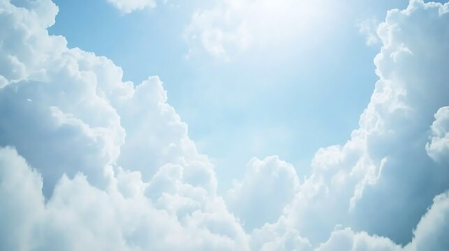 A dreamy sky with clouds resembling soft cotton balls, drifting gently across the expansive blue sky, offering a calming scene.