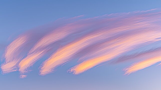 A mesmerizing sunset sky with a gradient of rich pink and purple hues, the soft clouds illuminated by the last rays of the sun, creating a vibrant and peaceful evening scene.