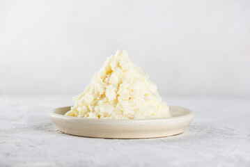 Edible shea butter in a plate on light table.