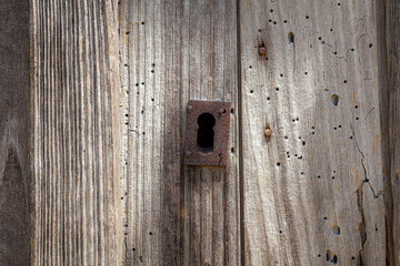 Ancien keyhole on a wooden door