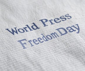 Close-up of newspaper highlighting World Press Freedom Day and the importance of journalism integrity and media rights