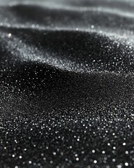 Captivating Black Sand Dune Landscape with Sparkling Glimmering Particles in a Macro Close Up Shot
