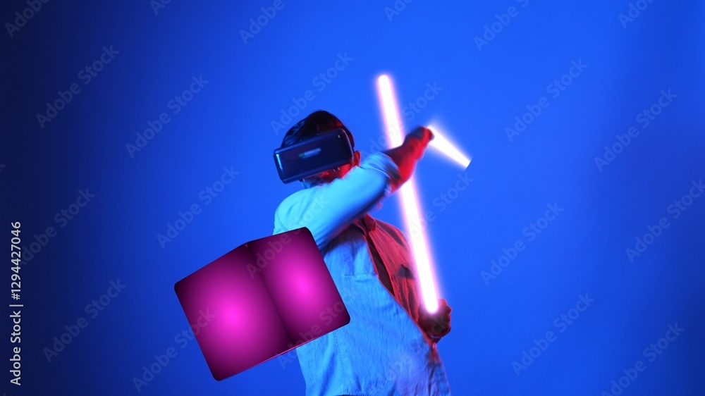 Poster gamer playing game while holding glowing sword and wearing vr glasses. attractive male model excited