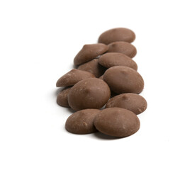 dark chocolate drops on white background