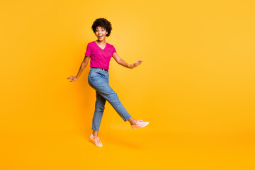 Copyspace photo of cheerful charming cute attractive curly wavy sweet pretty girlfriend rejoicing with sales isolated over yellow vivid color background
