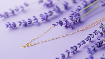 Close-up of a gold necklace with delicate engravings on a pastel lavender background