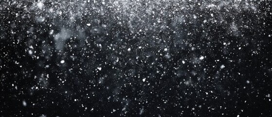 Fototapeta premium Ethereal snow falling gently against a dark background, creating a mesmerizing winter scene with a soft and dreamy quality, captured in a high resolution