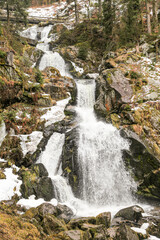 A waterfall in Triberg Germany black forest is flowing into a river