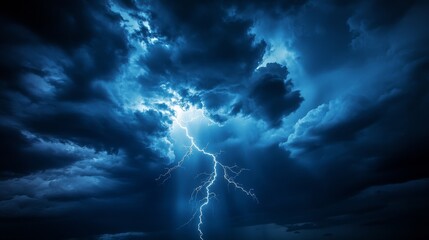 A majestic bolt of lightning pierces through stormy clouds, highlighting their dramatic movements in the night sky.