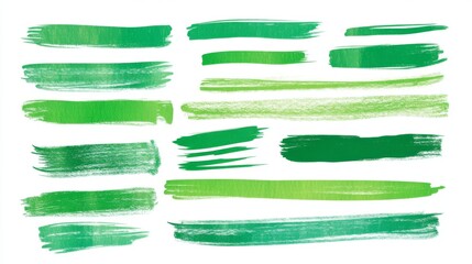 Obraz premium Green brush strokes on white background featuring varied shades and styles