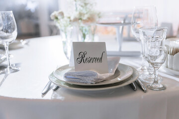 A plate with the inscription reserved at the guest's place at the table for celebrating events